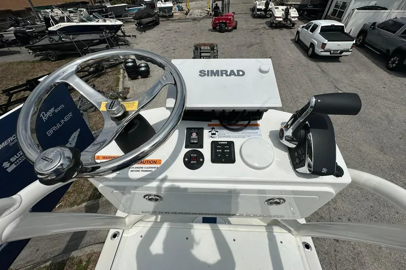 Slide: The Image of 2026 Ranger 2660 Bay boat helm with Simrad navigation system and steering wheel. - 38