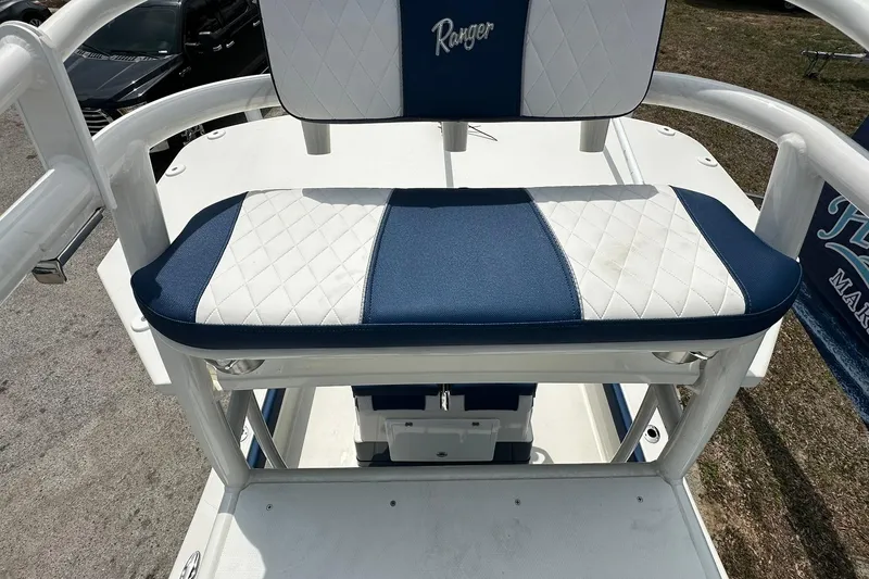 Slide: The Image of 2026 Ranger 2660 Bay boat seat with blue and white diamond pattern upholstery. - 39