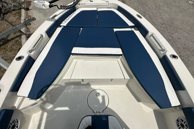 Slide: The Image of 2026 Ranger 2660 Bay boat interior with blue and white seating. - 4