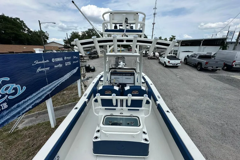 Slide: The Image of 2026 Ranger 2660 Bay boat with advanced navigation system, parked outdoors. - 45