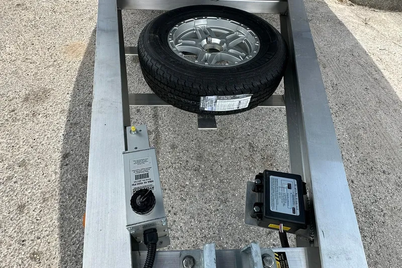 Slide: The Image of Trailer frame with spare tire and electronic components, Ranger 2660 Bay 2026 model. - 46