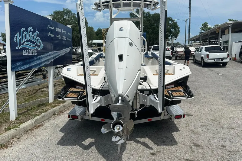 Slide: The Image of 2026 Ranger 2660 Bay boat on trailer at Holiday Marine dealership. - 47