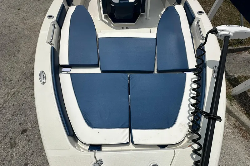 Slide: The Image of 2026 Ranger 2660 Bay boat with blue cushioned seating and trolling motor. - 5