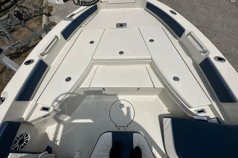 Slide: The Image of 2026 Ranger 2660 Bay boat interior with seating and storage compartments. - 6