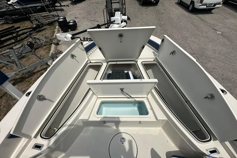 Slide: The Image of Open storage compartments on a 2026 Ranger 2660 Bay boat, showcasing ample space. - 8