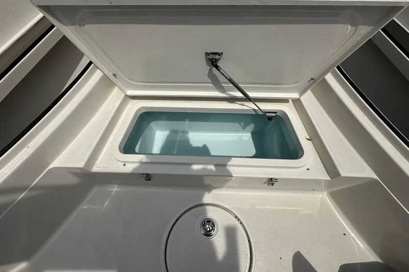 Slide: The Image of Open storage compartment on 2026 Ranger 2660 Bay boat, showcasing interior space. - 9