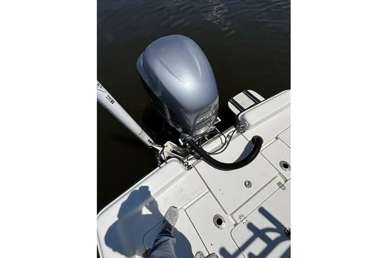 Slide: The Image of 2018 ShearWater 25 LTD boat with outboard motor on water. - 8