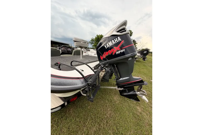 Slide: The Image of 2001 Triton Tr-19 boat with Yamaha VMAX HPDI outboard motor on grass. - 5