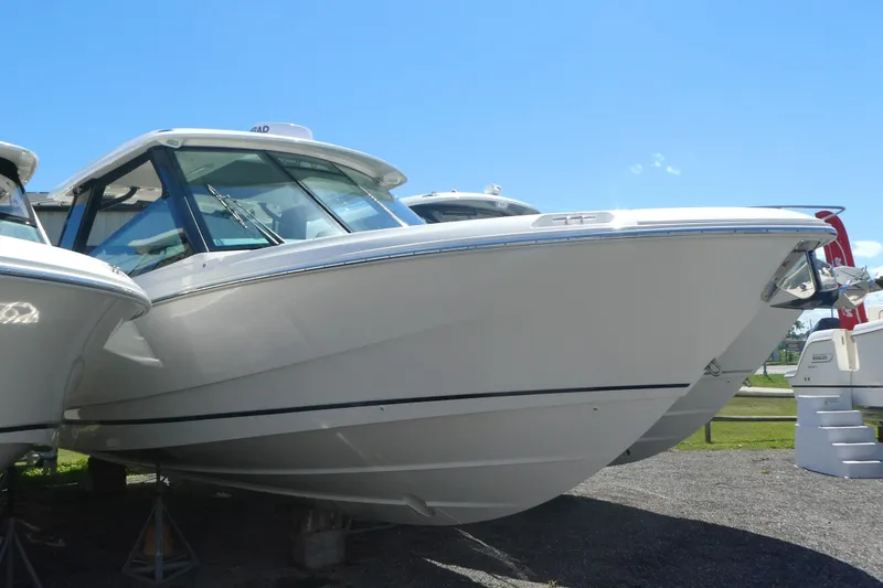 The Image of 2026 Boston Whaler 330 Vantage boat displayed outdoors on a sunny day. - 0
