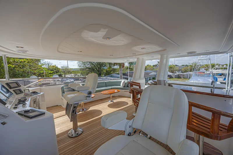 Slide: The Image of Luxurious 2011 Westport 112 yacht interior with modern seating and navigation controls. - 16