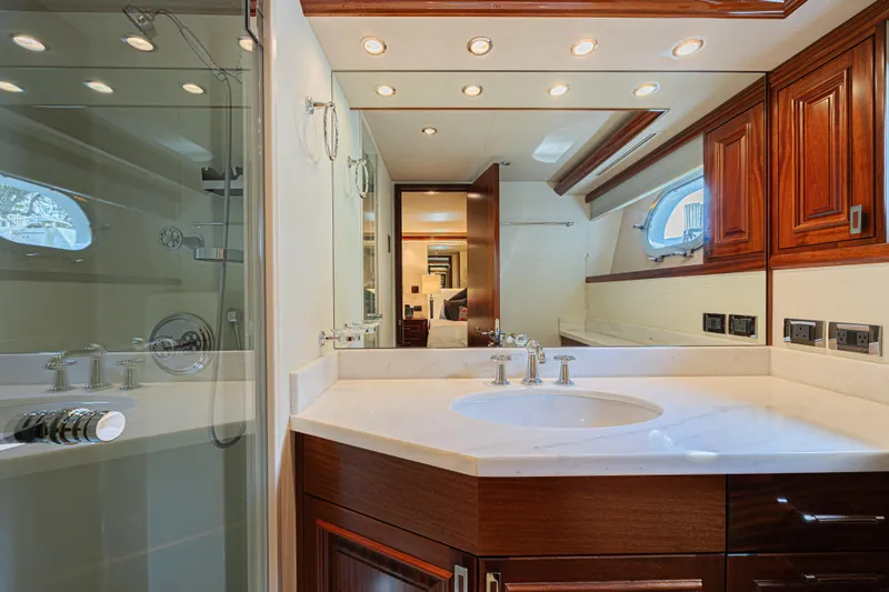 Slide: The Image of Luxurious bathroom interior on 2011 Westport 112 yacht with elegant wood cabinetry. - 41