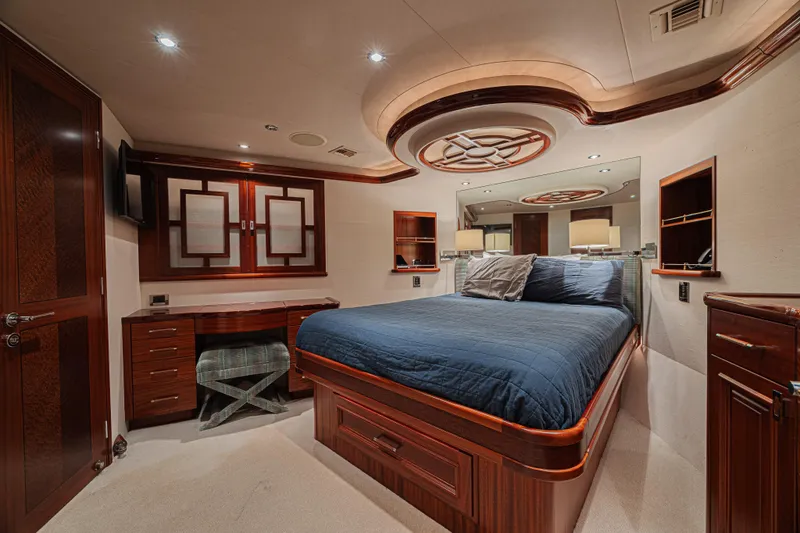 Slide: The Image of Luxurious bedroom interior on 2011 Westport 112 yacht, featuring elegant wood finishes and modern design. - 50
