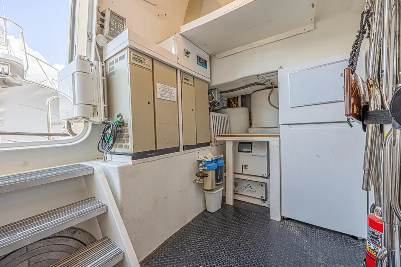 Slide: The Image of Utility area on a 2011 Westport 112 yacht with equipment and storage. - 63