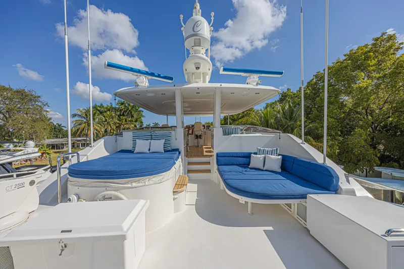 Slide: The Image of Luxurious 2011 Westport 112 yacht deck with blue seating and clear skies. - 7
