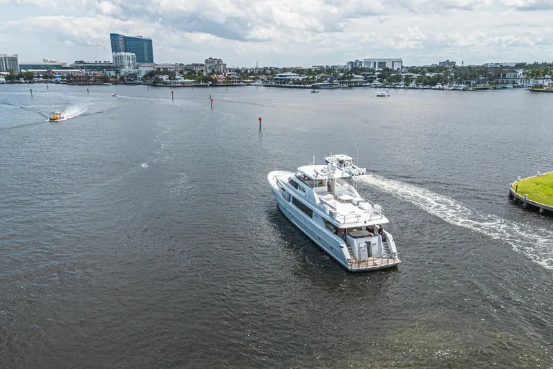 Slide: The Image of Luxury yacht Westport 112 (2011) cruising in a scenic harbor with city skyline. - 75