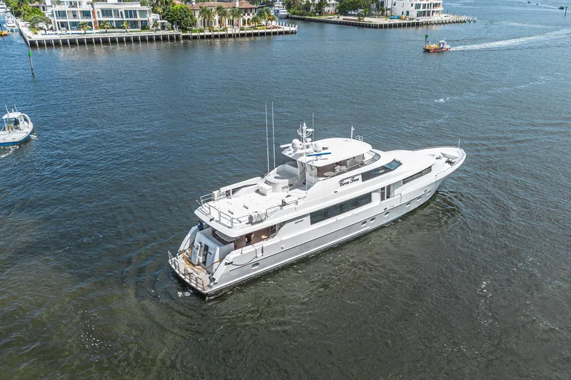 Slide: The Image of Luxurious 2011 Westport 112 yacht cruising near waterfront homes. - 77