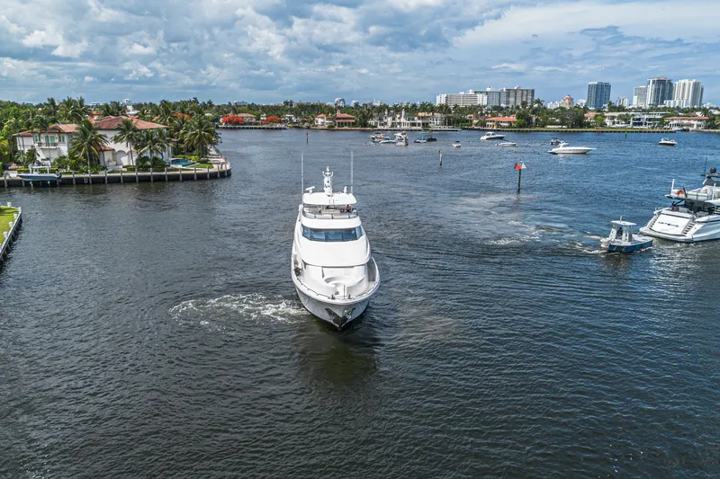 Slide: The Image of Luxurious 2011 Westport 112 yacht cruising in a scenic waterfront setting. - 79