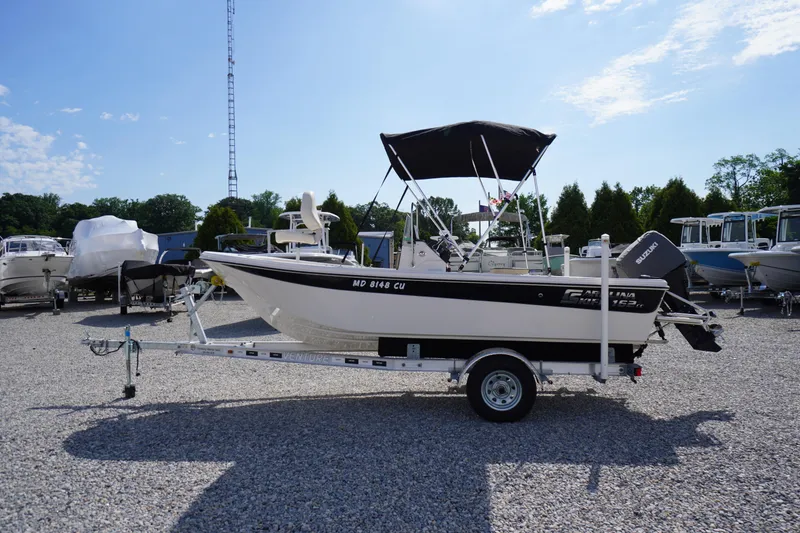 The Image of 2024 Carolina Skiff 182 boat on trailer in sunny outdoor setting. - 0