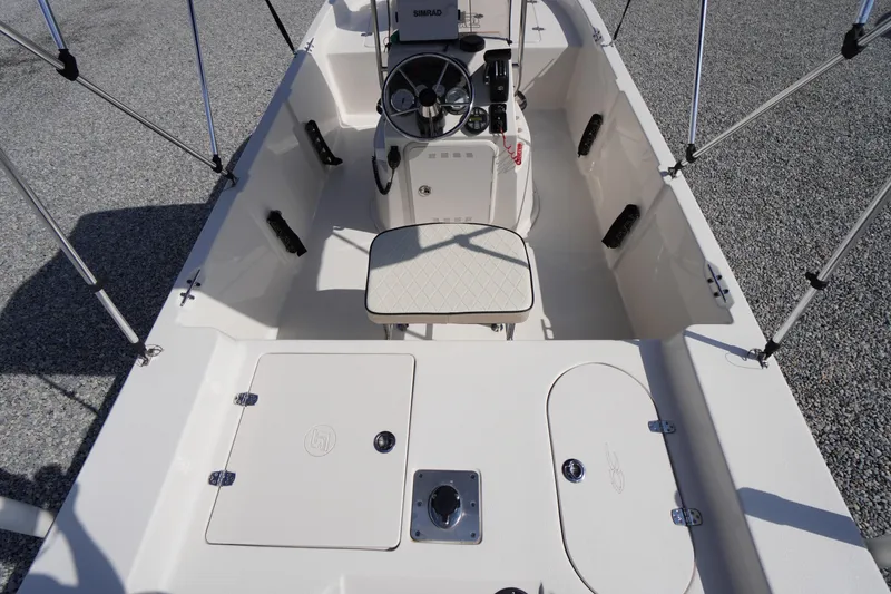 Slide: The Image of 2024 Carolina Skiff 182 boat interior with steering console and seating. - 15