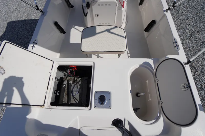 Slide: The Image of 2024 Carolina Skiff 182 boat interior with storage compartments and seating. - 17