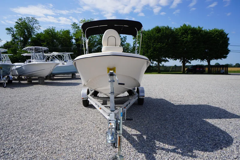 Slide: The Image of 2024 Carolina Skiff 182 boat on trailer in outdoor lot. - 2