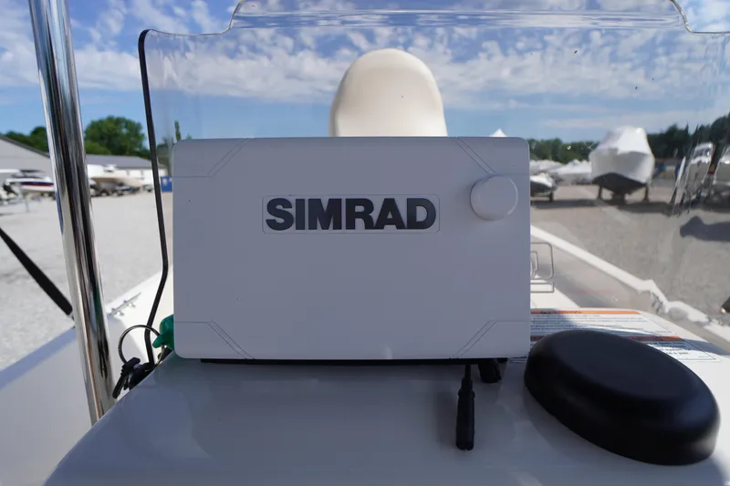 Slide: The Image of 2024 Carolina Skiff 182 boat with Simrad navigation system on console. - 23