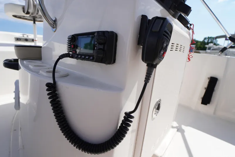 Slide: The Image of VHF radio mounted on 2024 Carolina Skiff 182 boat console. - 26
