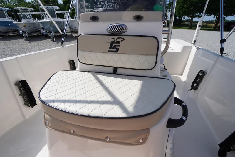 Slide: The Image of 2024 Carolina Skiff 182 boat interior with cushioned seating and sleek design. - 33