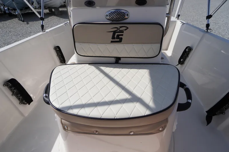 Slide: The Image of 2024 Carolina Skiff 182 boat interior with cushioned seating and storage. - 34