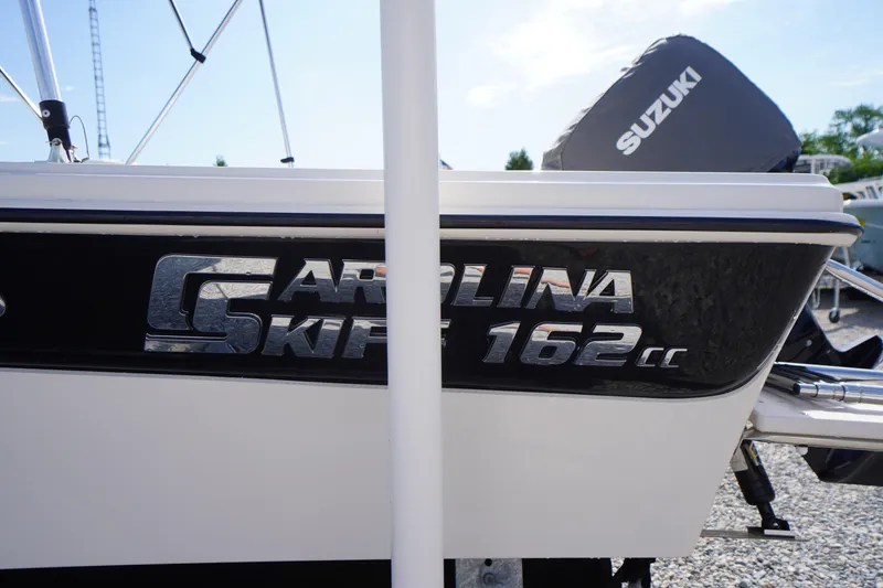 Slide: The Image of 2024 Carolina Skiff 182 boat with Suzuki engine, side view. - 4