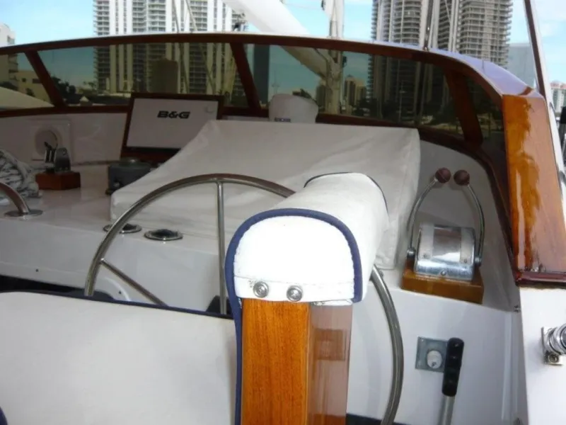 Slide: The Image of 1990 Cheoy Lee Sloop cockpit with steering wheel and navigation equipment. - 21