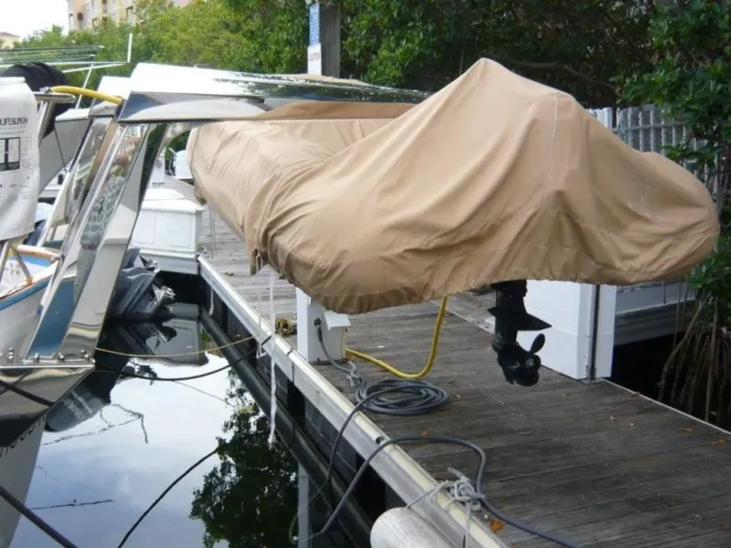Slide: The Image of Covered boat docked at marina, Cheoy Lee Sloop, 1990 model. - 6