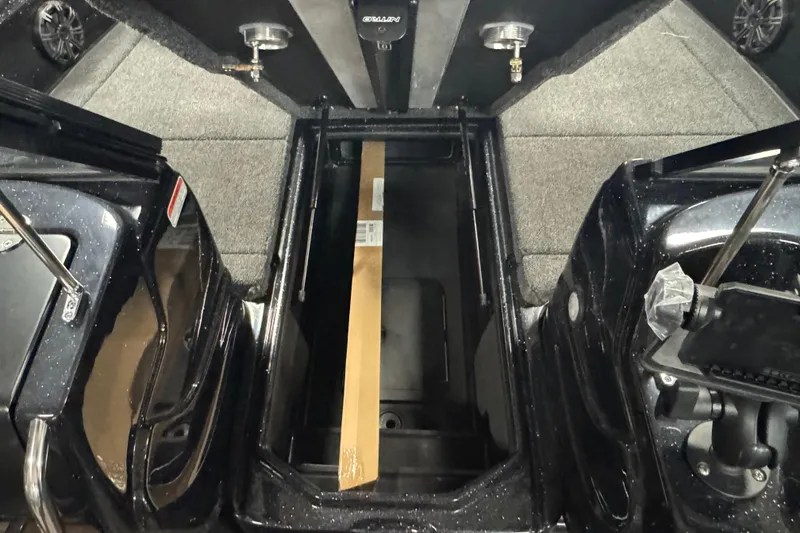 Slide: The Image of Interior view of 2026 Nitro ZV19 Sport Pro boat storage compartment with carpeted flooring. - 11