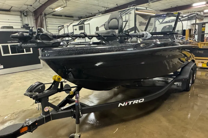 Slide: The Image of 2026 Nitro ZV19 Sport Pro boat in a garage, featuring Garmin equipment. - 12