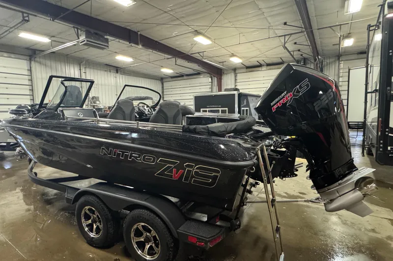Slide: The Image of 2026 Nitro ZV19 Sport Pro boat in a garage, featuring a powerful Mercury Pro XS engine. - 17