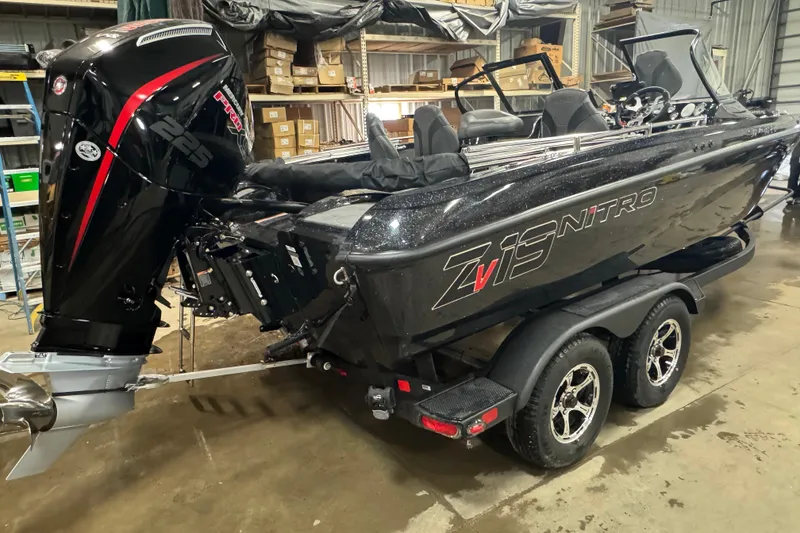 Slide: The Image of 2026 Nitro ZV19 Sport Pro boat with powerful engine in a garage setting. - 3
