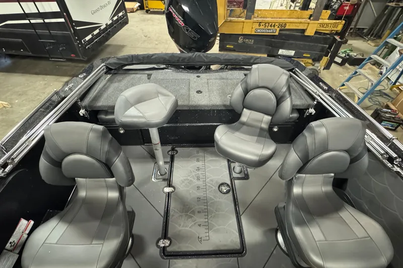 Slide: The Image of Interior of 2026 Nitro ZV19 Sport Pro boat with gray seating and fishing setup. - 7