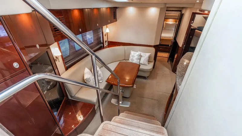 Slide: The Image of Luxurious interior of 2008 Sea Ray Sundancer yacht with elegant seating and wooden finishes. - 9