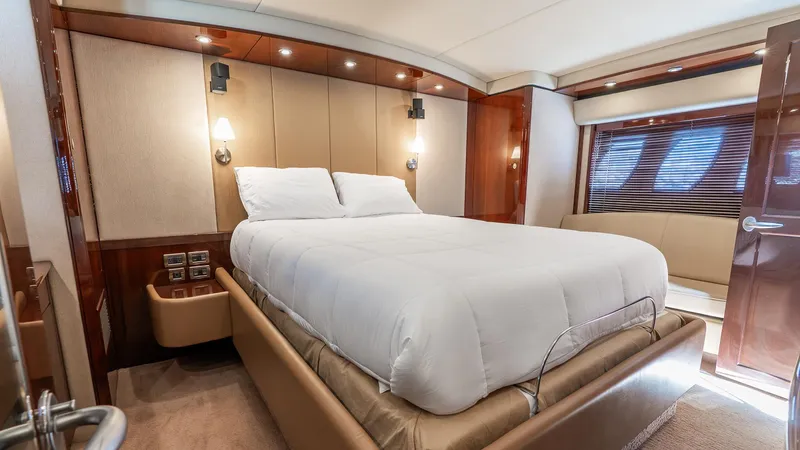Slide: The Image of Luxurious bedroom interior of 2008 Sea Ray Sundancer yacht with elegant wood finishes. - 22
