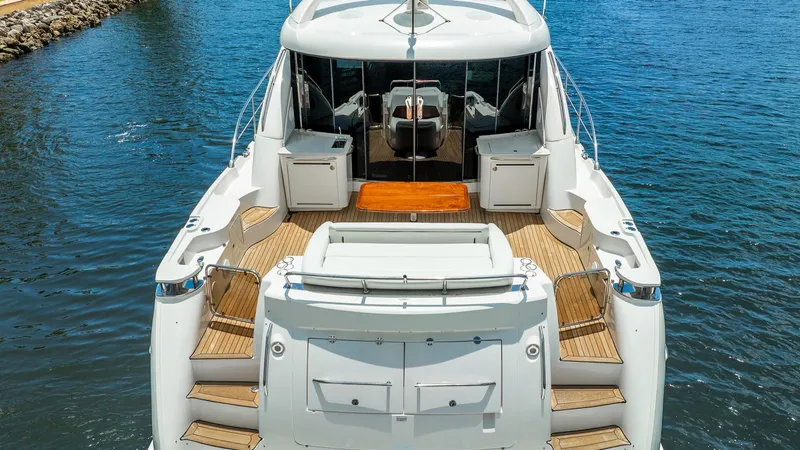 Slide: The Image of 2008 Sea Ray Sundancer yacht with spacious deck and elegant design on calm water. - 7