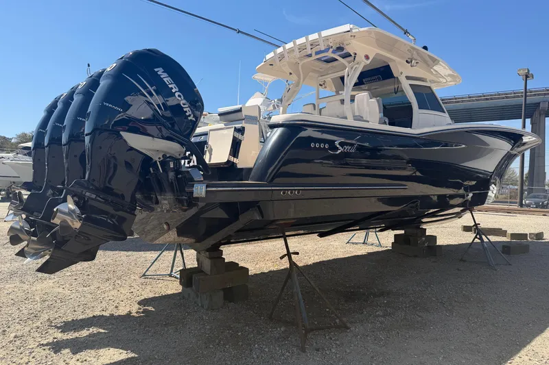 Slide: The Image of 2020 Scout 380 LXF boat with Mercury engines on display outdoors. - 7