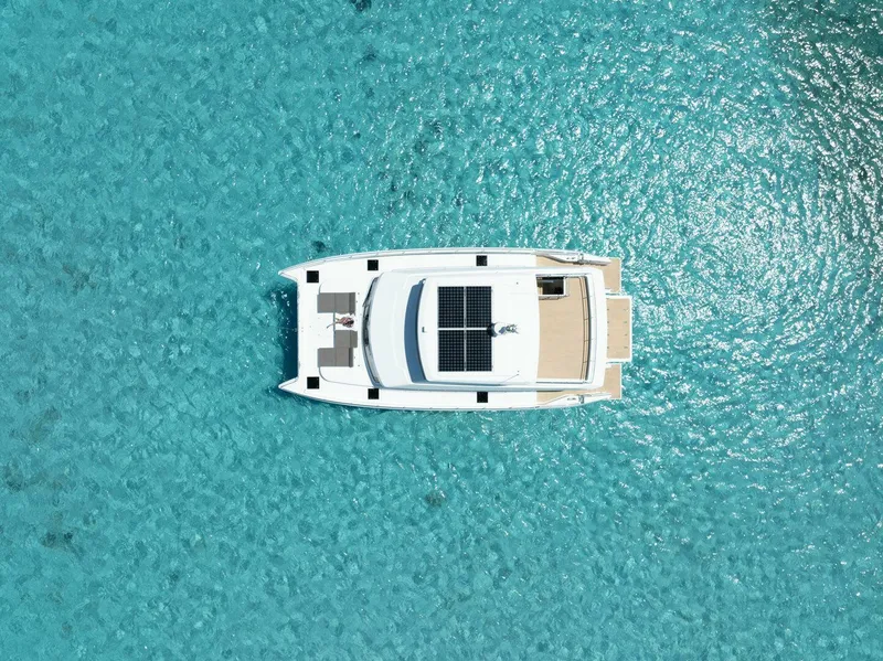 Slide: The Image of Aerial view of ILIAD 53F yacht on clear turquoise water, 2026 model. - 4