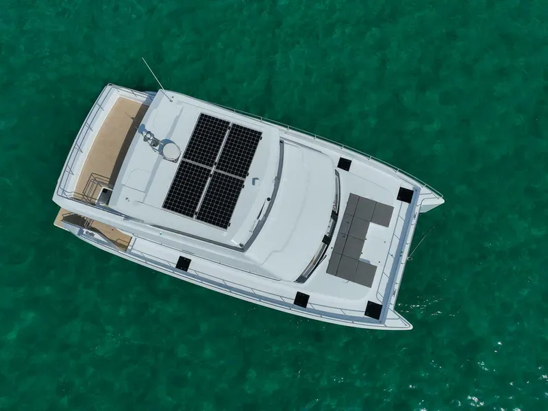Slide: The Image of Aerial view of 2026 ILIAD 53F yacht with solar panels on turquoise water. - 9