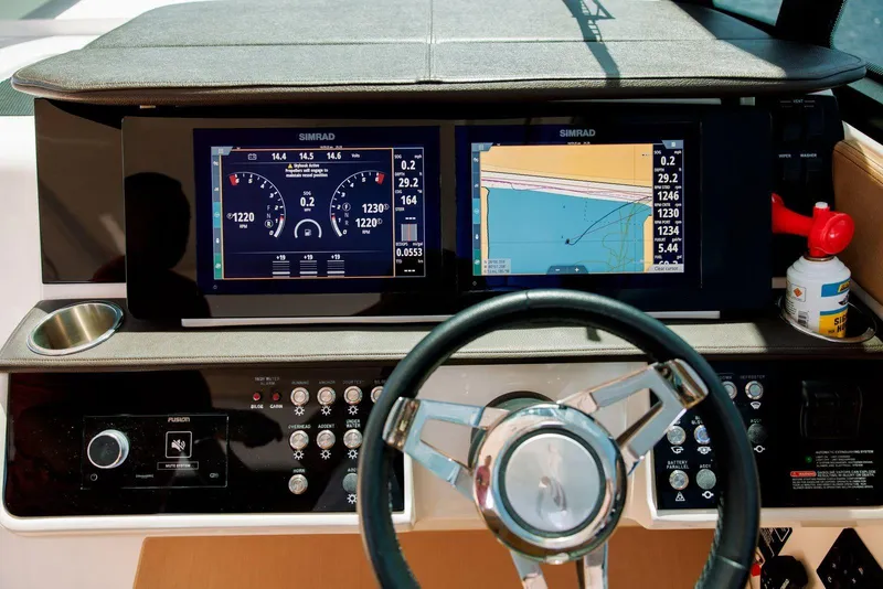 Slide: The Image of Dashboard of 2022 Sea Ray Sundancer 320 Outboard with navigation and control displays. - 10