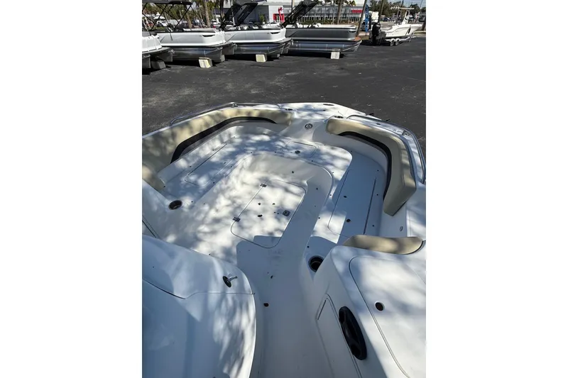 Slide: The Image of 2019 Hurricane SunDeck Sport CC 231 OB boat interior with spacious seating and sleek design. - 10