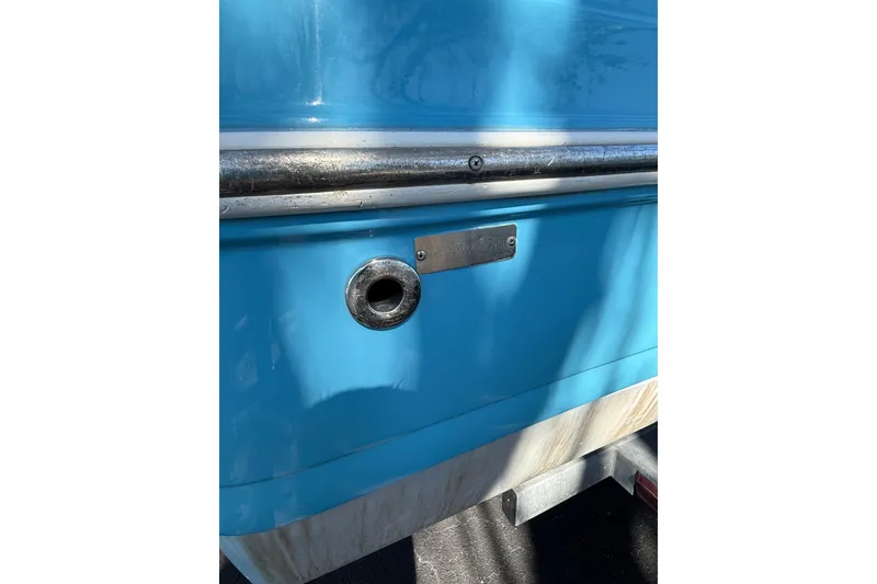 Slide: The Image of Close-up of a 2019 Hurricane SunDeck Sport CC 231 OB boat's blue hull detail. - 6