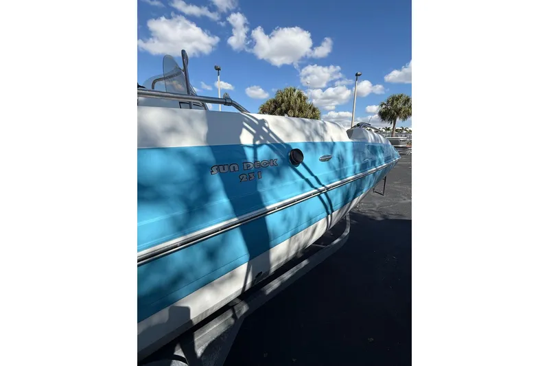 Slide: The Image of 2019 Hurricane SunDeck Sport CC 231 OB boat under clear blue sky. - 8