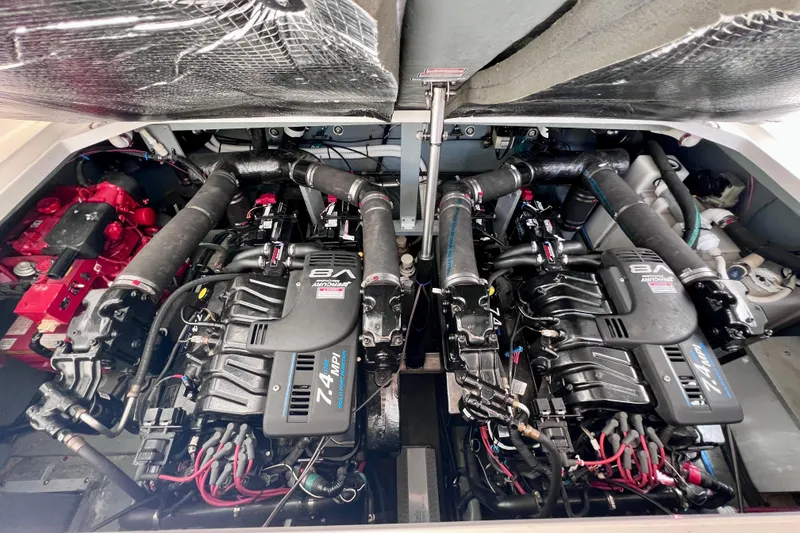 Slide: The Image of Twin engines in a 2000 Sea Ray 340 Sundancer boat, showcasing powerful marine machinery. - 16