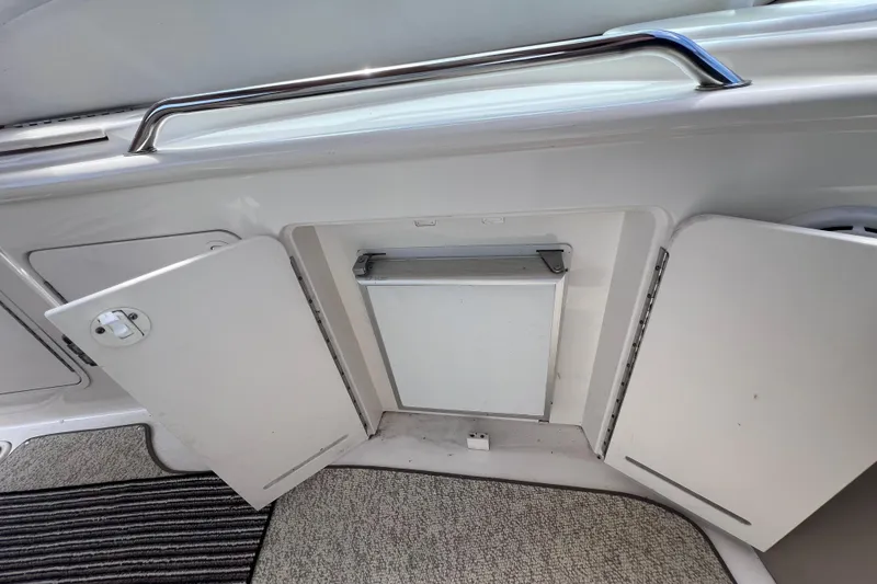 Slide: The Image of Open storage compartment on a 2000 Sea Ray 340 Sundancer boat interior. - 7
