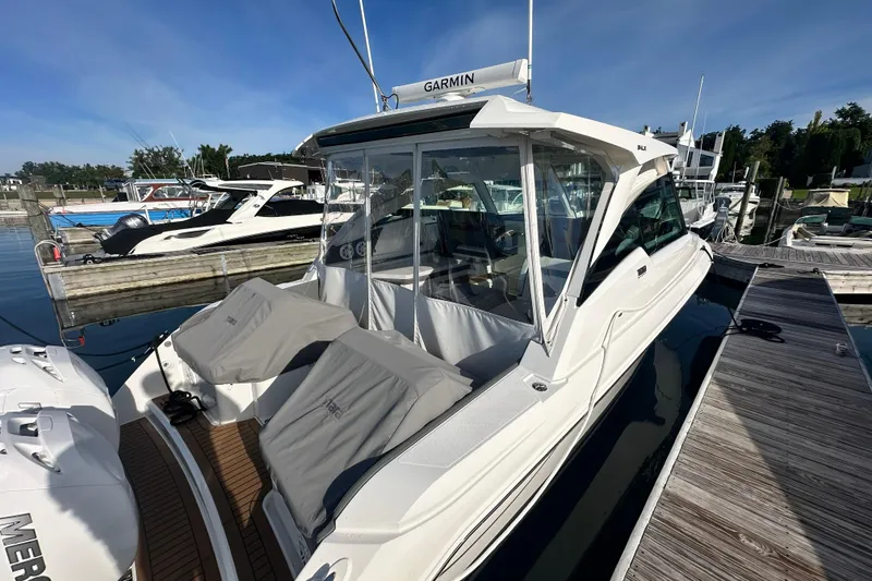 Slide: The Image of 2021 Tiara Yachts 34 LX docked, featuring sleek design and modern amenities. - 4